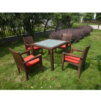 China 4 Seater Outdoor Restaurant Furniture Table And Stackable Garden Rattan Dining Arm Chair