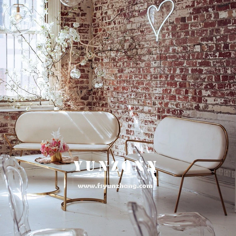 Gold sofa with decorative pillows