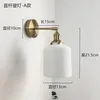 Lámpara de pared con barra recta de cerámica.