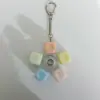 Gummy round cap rotating button keychain