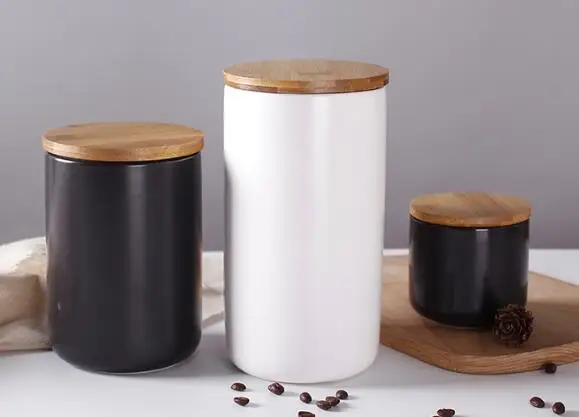 Practical customizable white black kitchenware ceramic storage jar with a wooden lid for home uses