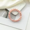 Gomas para el pelo rosa de 1 cm.