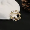 GO0382-10 Spilla con perle premium