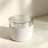White bottle with silver lid