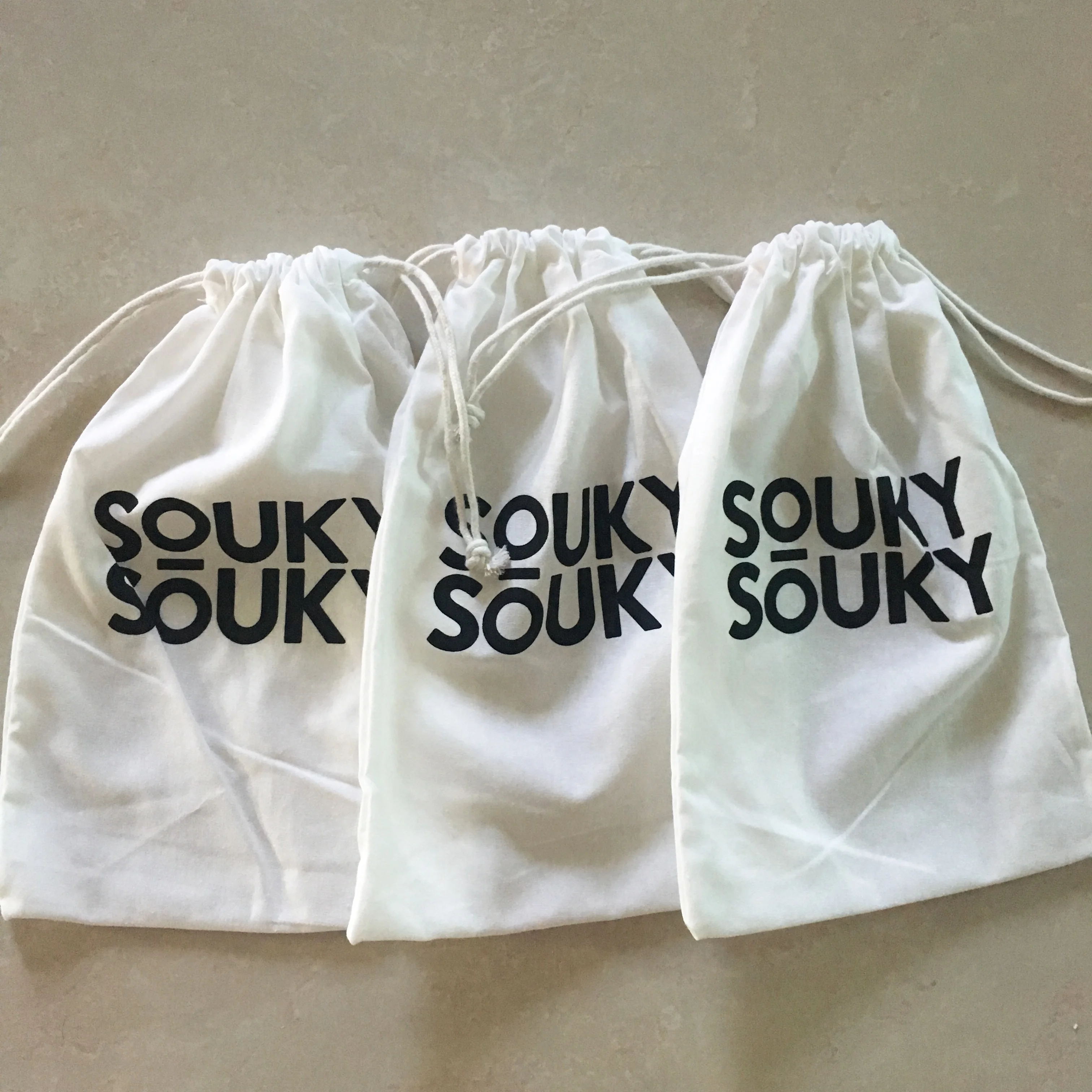 small white drawstring bags