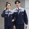 gray top and navy blue bottom suit