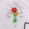 Red and yellow flower with leaf