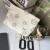 Beige smiley makeup bag