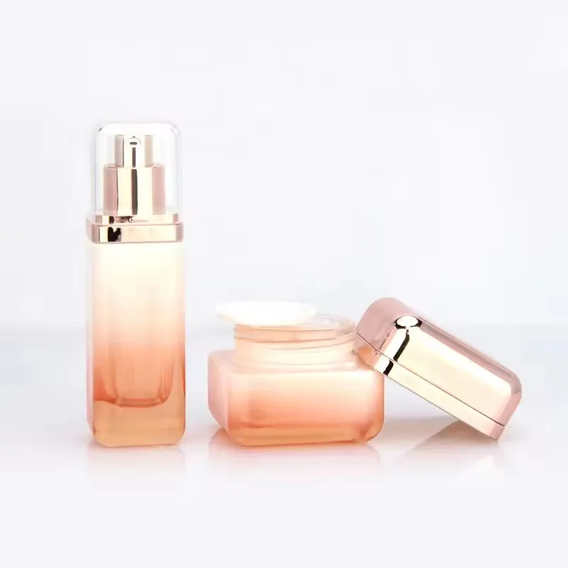 Supplier Cosmetic square glass bottle set Innovative design of rose gold cover for skincare packaging 50g40ml100ml120ml