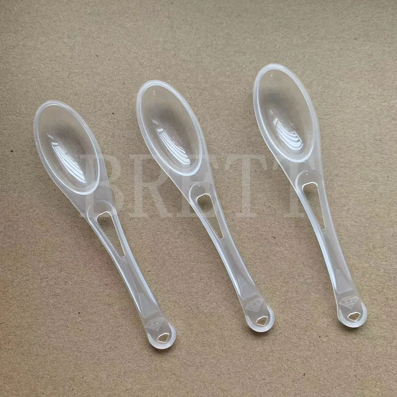 Hot selling 7g disposable foil seal wrapped plastic honey spoon wholesale