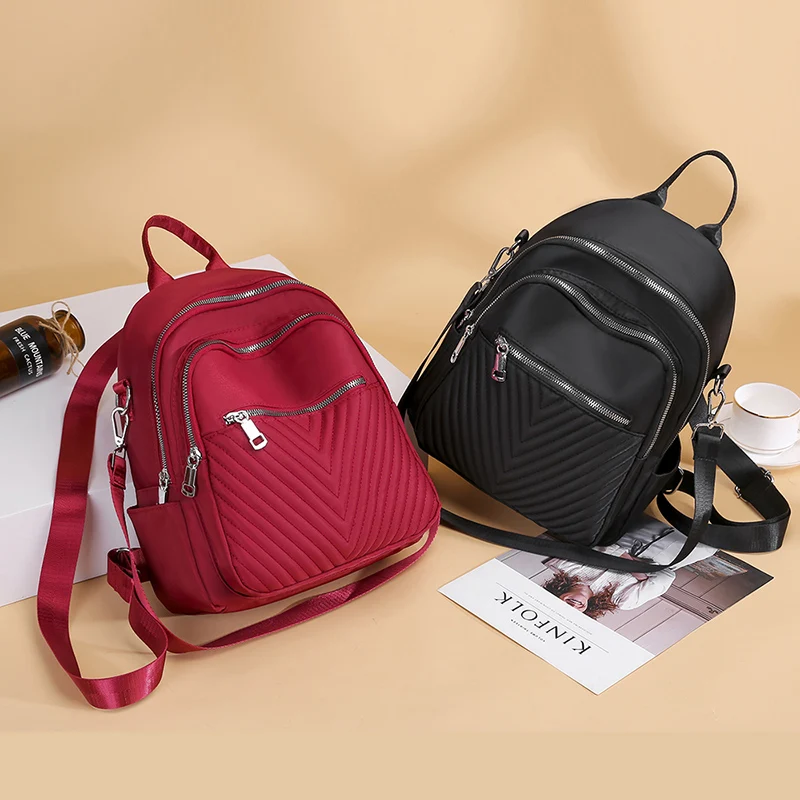 Woman New Style PU ​​backpack Leisure Fashion Hit Color V Word High-end Bag 