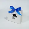 White bag with blue ribbon