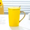 Glossy yellow porcelain lid with gold spoon