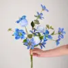 Blue amaryllis and light blue dandelion bouquet