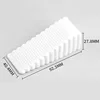 Large white triangular door stop