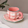 Tazza e piattino a righe rosa