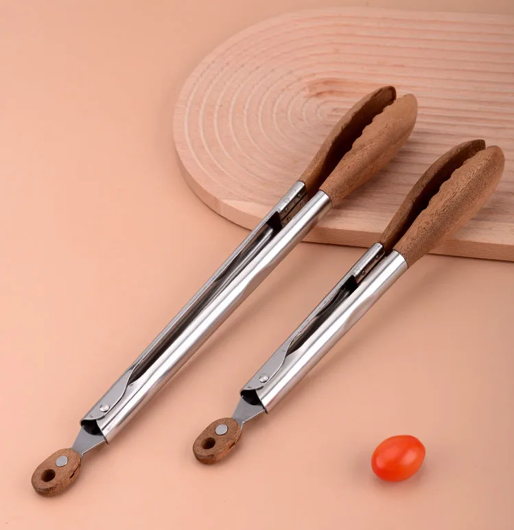 Hot Sale Stainless Steel Walnut Olive Wooden Kitchen BBQ Spaghetti Meat Garlic Clip Fry Food Tongs With Wood Lock manufacture