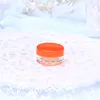 clear jar with orange cap