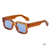 Lente blu con cornice arancione