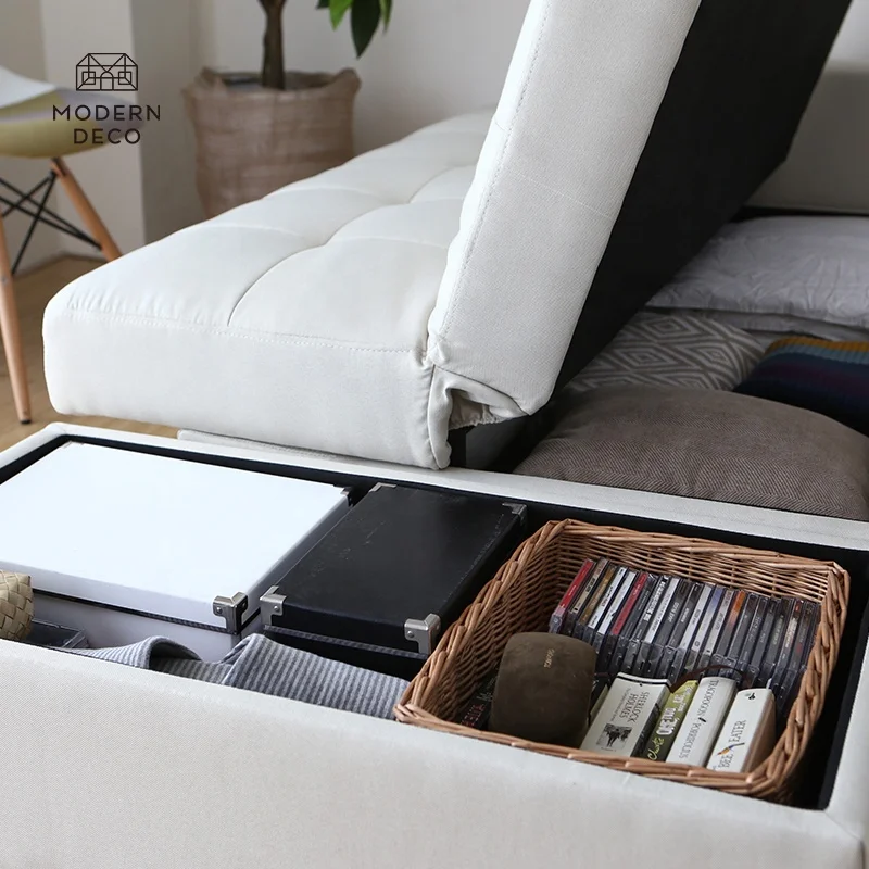 Tekstilna kotarna sekcionalna sofa s hranilnico za nameščanje v sobi z sofo-krevetom