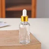 Golden ring + White plastic dropper + Transparent bottle