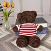 Maglione a righe bianche e rosse orso nero