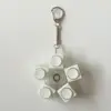 Blue-ringed octopus spinning-button keychain