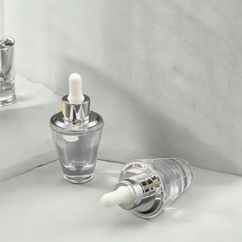 China Factory Wholesale 30ml 1oz Clear Glass Dropper Bottles Silver Collar Serum Skincare Essential Oils Screen Printed Surface