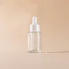clear bottle + plastic white ring + white rubber head