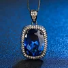 Black gold Blue pointed crystal pendant with chain