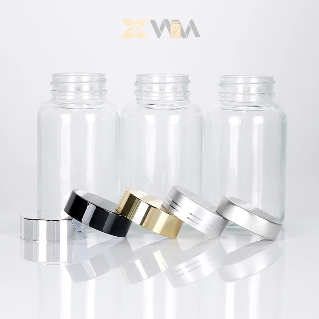 Pharmaceutical grade Customized Wide Mouth Clear Pill Jar Supplement Capsule Glass Bottle With Plastic Aluminium Gold Cap