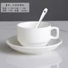 Small coffee cup with saucer and spoon