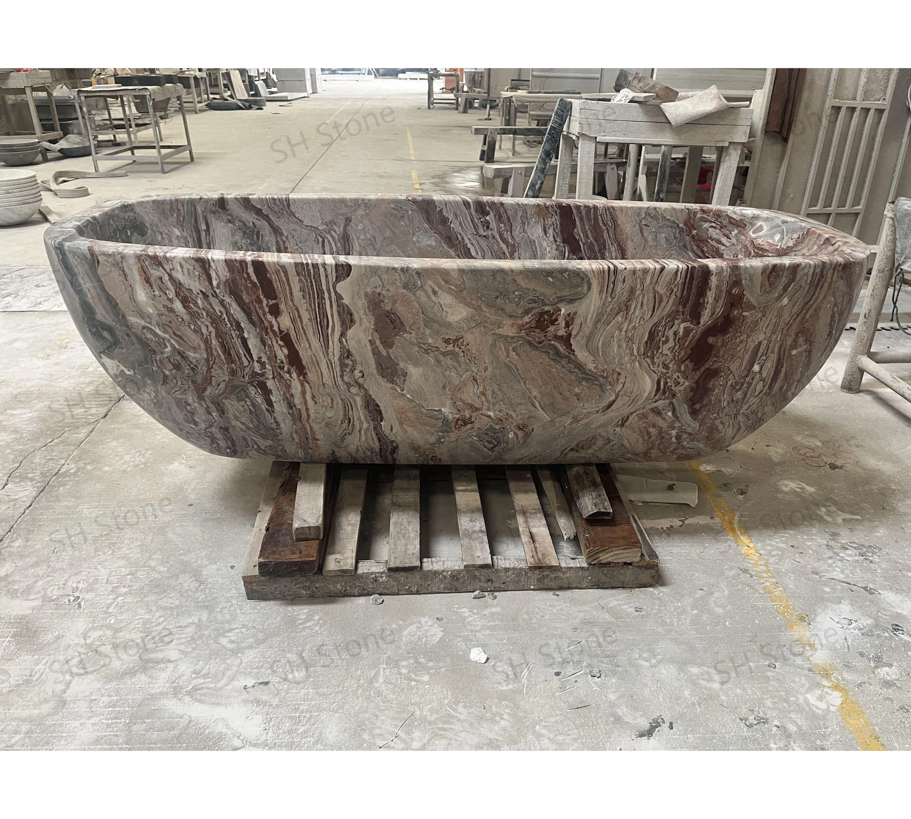 SHLuxurious custom modern oval-shaped bathtub – Monica Red Marble freestanding stone bathtub. Handcrafted exclusively for premium bathrooms and hotels.