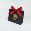 Black bag with red ribbon