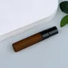 Frosted amber bottle + black sprayer