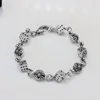 BRDICE02ANTIQUESILVER Bracciale con perline a forma di dado e croce