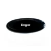 Insignia negra + logo plateado