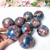 Sfera di Apatite Blu con Mica Viola e Pietra del Sole