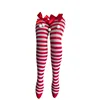 Red and white striped red bow with pom-pom