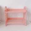 Estante de almacenamiento rosa de doble capa.