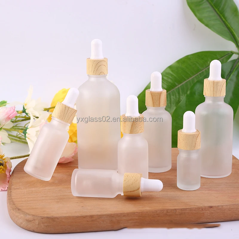 Frosted Essential Oil glass bottle serum glass bottle Flat Shoulder Dropper bottle with Plastic environmentally wood grain ring supplier