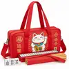 Gato rojo de la suerte