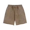 Pantaloncini color sabbia con stampa a cera
