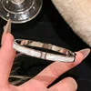 [17] bracelet incrusté de coquille d'argent