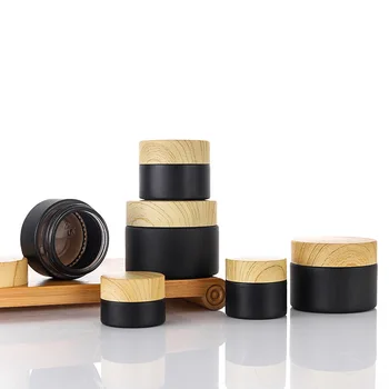 High quality frost matte black skin care face cream glass jars with water transfer wood bamboo grain plastic cap for cosmetic