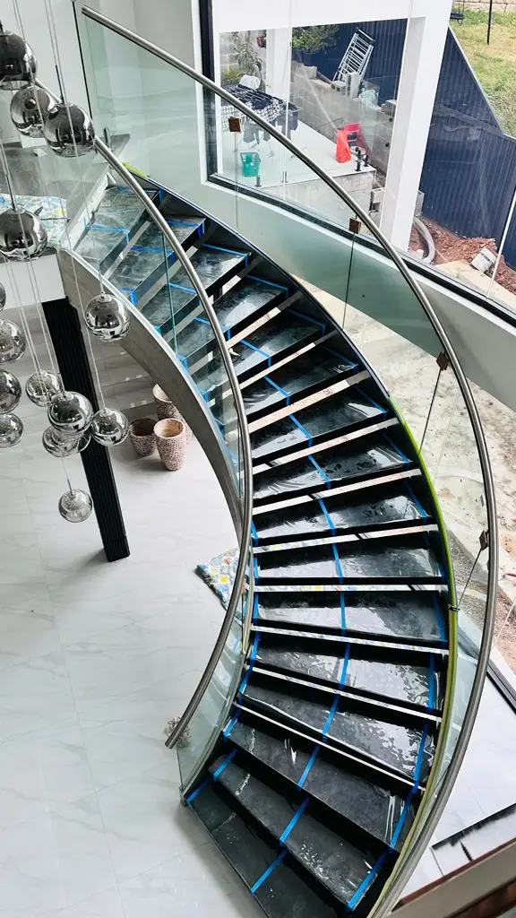 DB Luxury Villa Curved Staircase with Plate Railing Customized Marble Tread Design Stairs factory