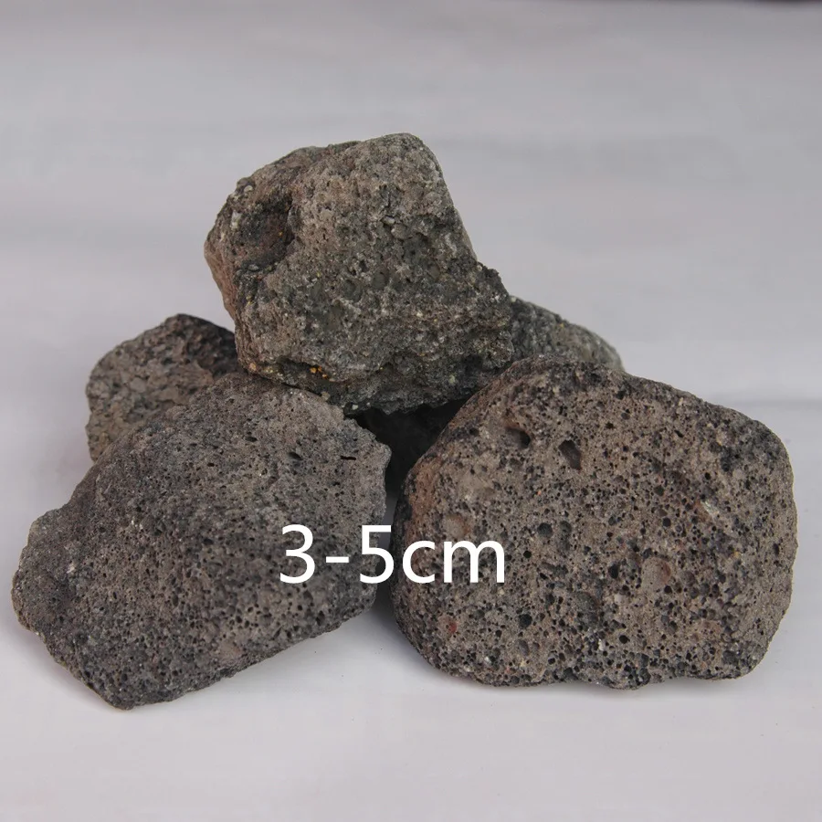 千軒石。水石 灰色と黒の不規則な岩 千軒石。黒色多孔質水石 廃番] 黒