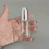 Clear with silver tops