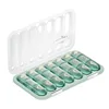 21-compartment pillbox [transparent green English label]