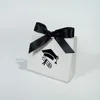 White bag with black ribbon